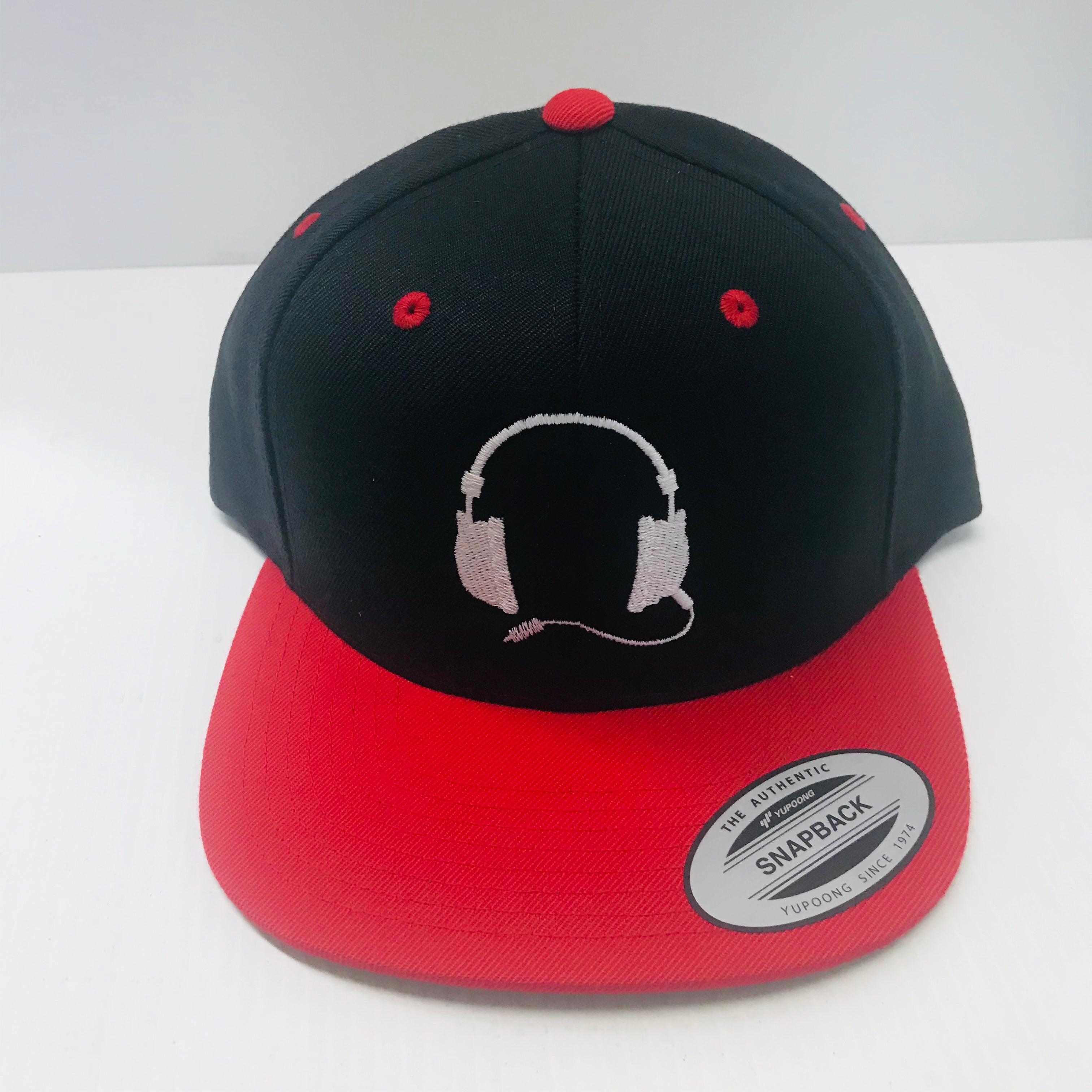 Black with red cap / white logo